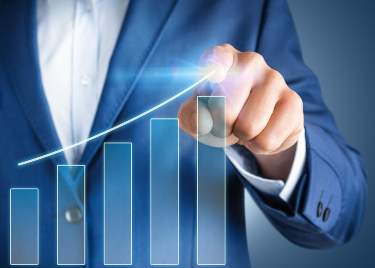 Businessman pointing at increasing graph. Business development, finance growth, investment concept,